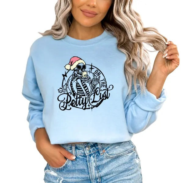On the Petty List Sweatshirt - Skeleton Holding Hot Cocoa Mug with Stocking Cap | Sarcastic & Funny Christmas Design | Perfect for Skulls & Humor Lovers | Festive & Playful Vibe | Ideal for Holiday Parties & Cozy Winter Days | Unique Holiday Sweatshirt
