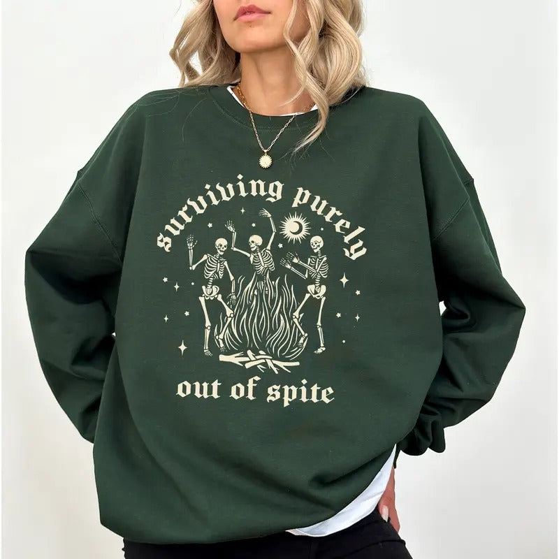 Surviving Purely Out Of Spite Skeleton Sweatshirt, Funny Dancing Skeleton Halloween Crewneck, Creepy Skeleton Sweater, Spooky Season Goth Sweatshirt for Women, Comfy Long Sleeve Pullover, Oversized Womens Tops, Casual Womenswear, Comfort Fabric Cotton Top